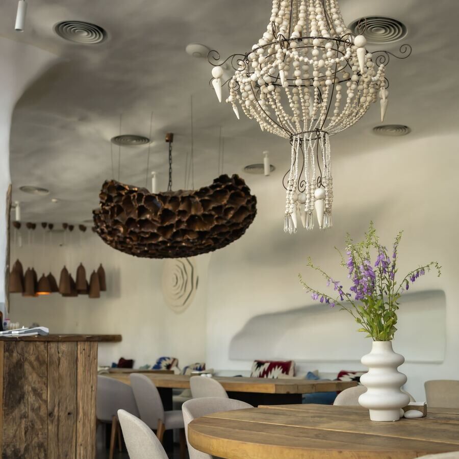 Elegant dining room with a chandelier and set tables